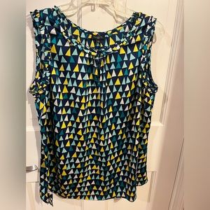 Talbots skeeveless navy and yellow patterned blouse.